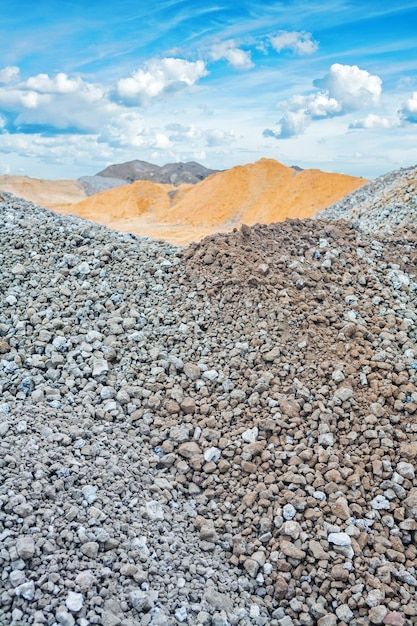 Premium Photo   Piles of construction sand and gravel on background of the sky