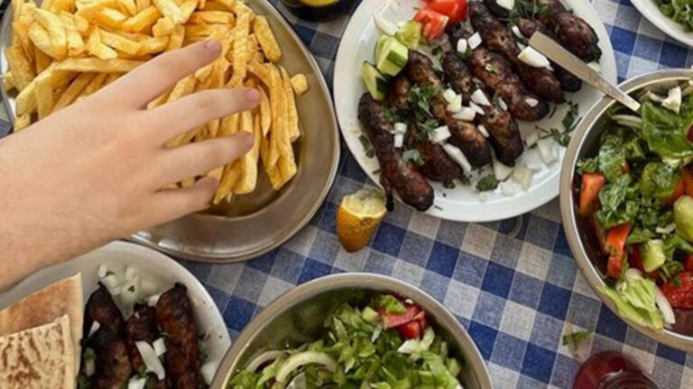 Traditional Mediterranean Feast with Grilled Kebabs Fresh Salads and Golden Fries 768x432